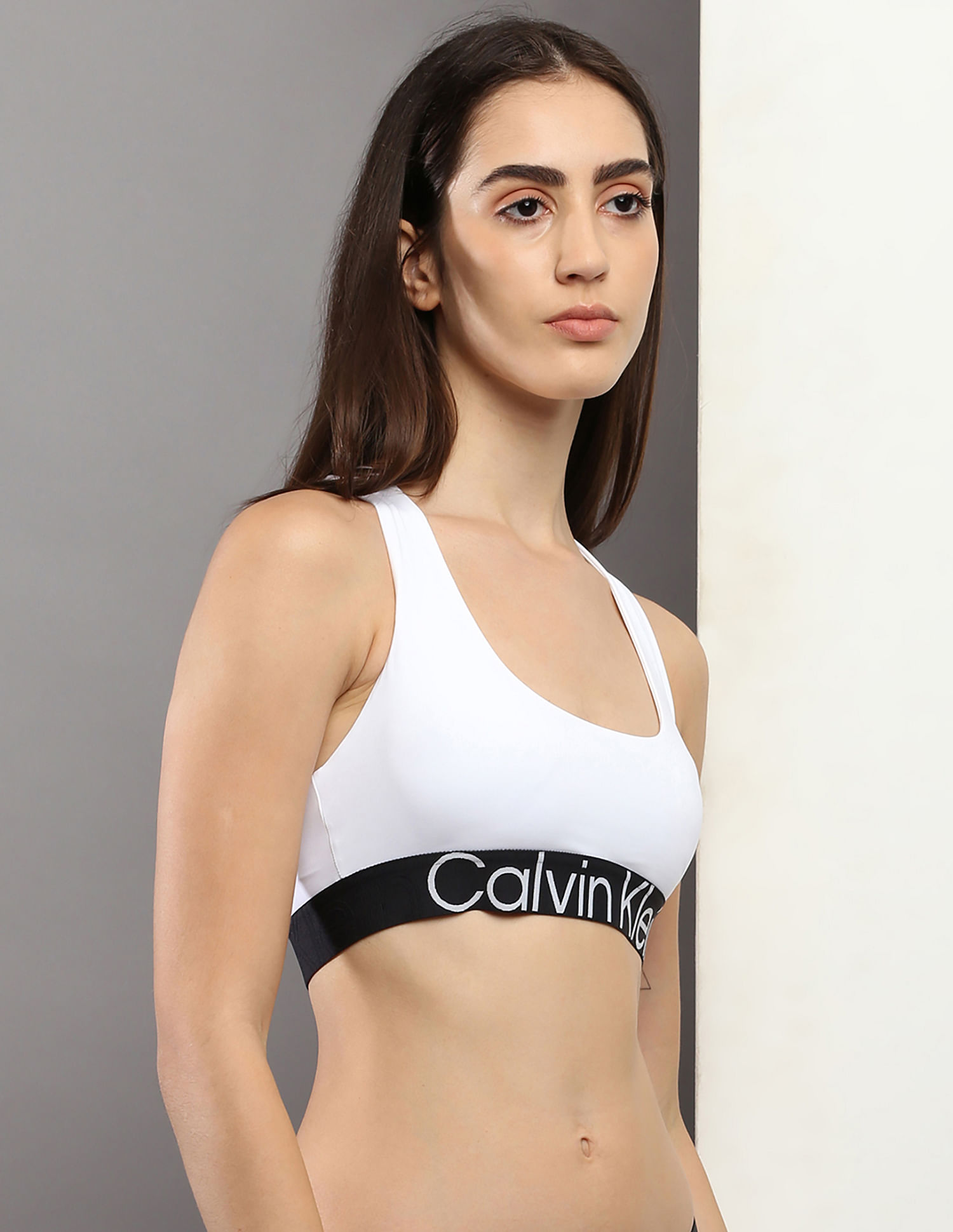 Buy Calvin Klein Underwear Medium Support Logo Under Band Sports Bra -  NNNOW.com